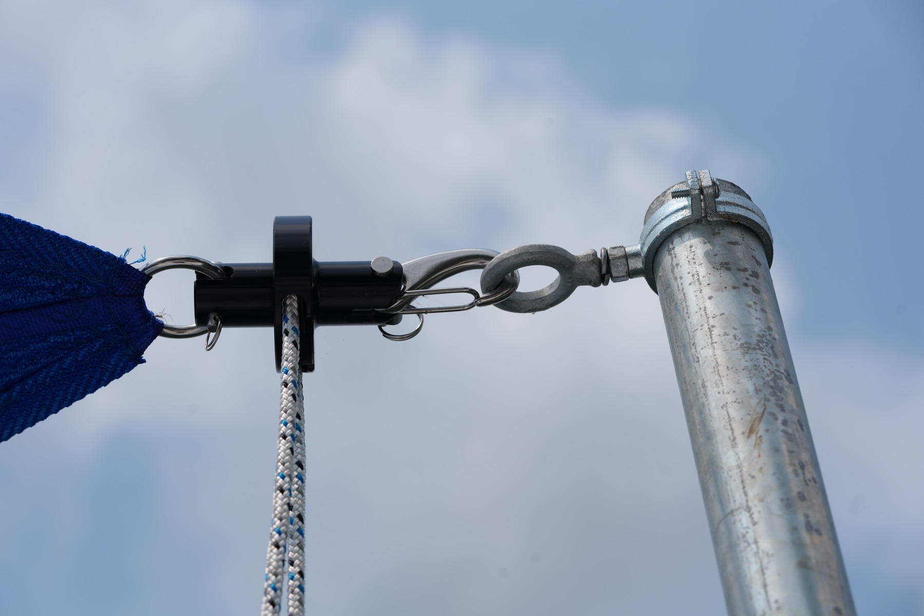 DockShade swivel furling hardware connected to a galvanized post
